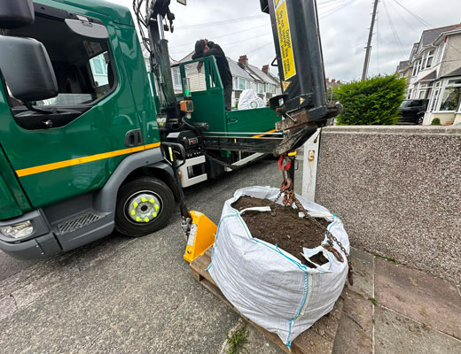 Skip Bag Hire Exeter. Full Skip bag and lifting crane.